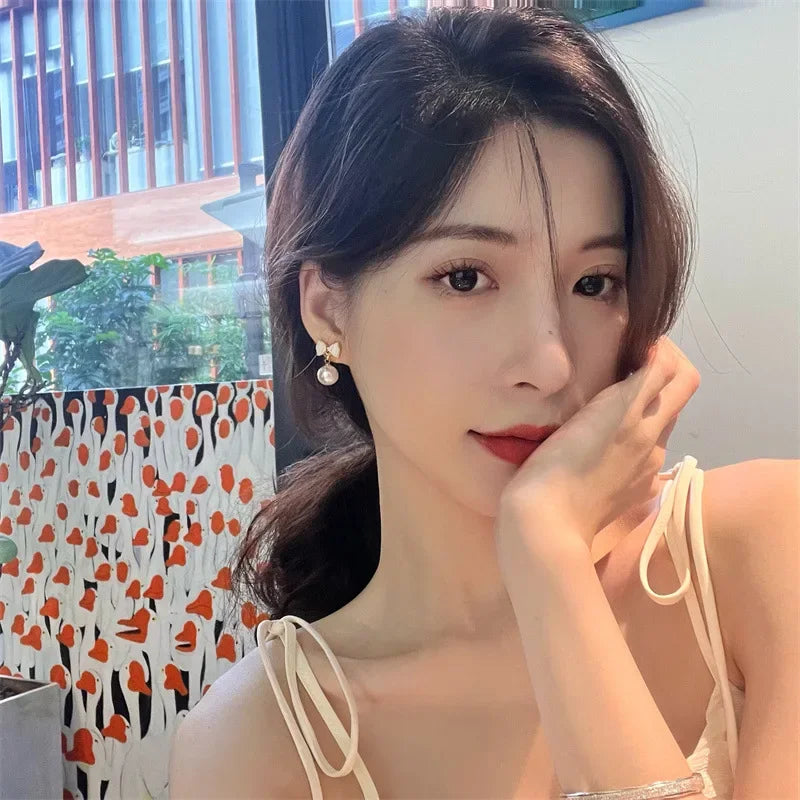 DAIIIBABYYY  -  Temperament Trendy White Bowknot Pearl Drop Dangle Earrings for Women Classic Butterfly Stud Earrings Party Jewelry Accessories