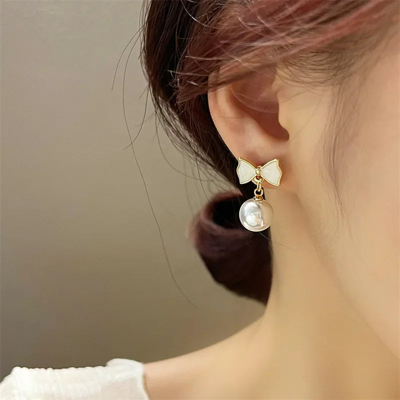 DAIIIBABYYY  -  Temperament Trendy White Bowknot Pearl Drop Dangle Earrings for Women Classic Butterfly Stud Earrings Party Jewelry Accessories