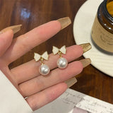 DAIIIBABYYY  -  Temperament Trendy White Bowknot Pearl Drop Dangle Earrings for Women Classic Butterfly Stud Earrings Party Jewelry Accessories
