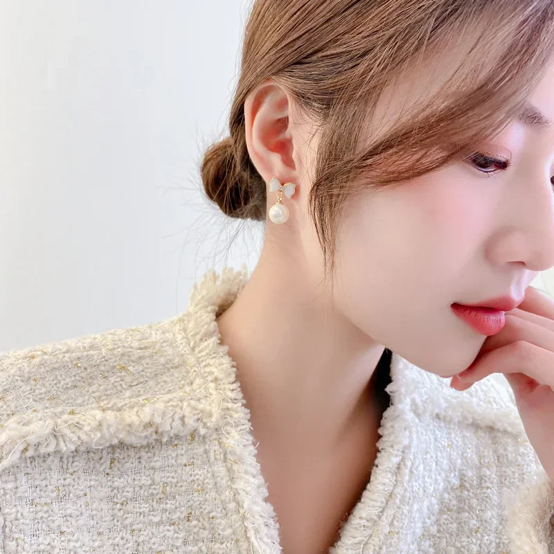DAIIIBABYYY  -  Temperament Trendy White Bowknot Pearl Drop Dangle Earrings for Women Classic Butterfly Stud Earrings Party Jewelry Accessories