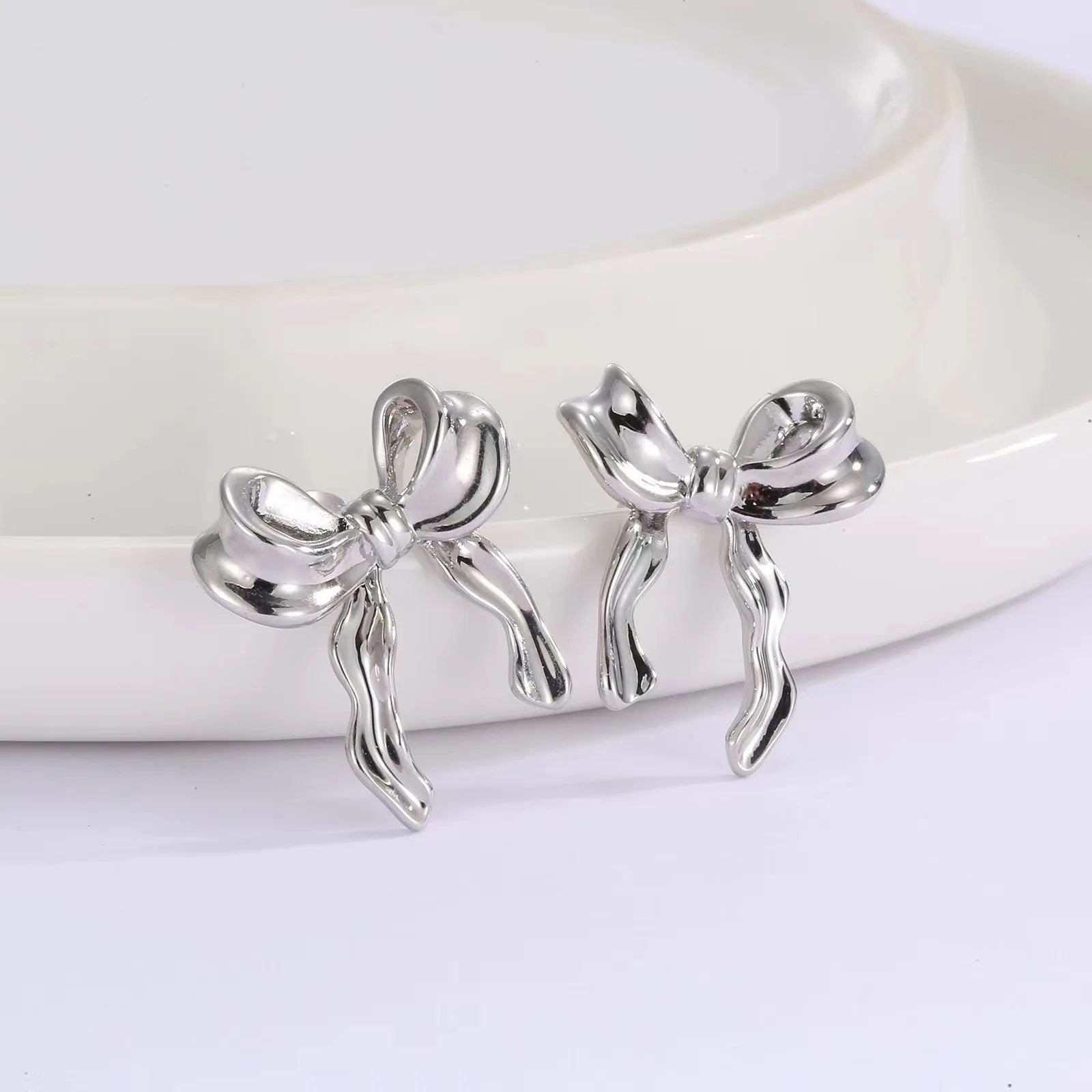 DAIIIBABYYY  -  Korean Fashion Ribbon Bow-knot Earrings for Women Cute Bow Metal Stud Earring Girls Charm Wedding Party Jewelry Gift