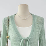 DAIIIBABYYY  -  Vacation Style Hollow Hook Flower Trumpet Sleeve V-neck Knitted Sweater Summer Bow Tie Single Breasted Mid Length Top
