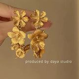 Daiiibabyyy  Exaggerated Metal Hollow Flower Drop Earrings for Women Luxury Gold Color Petal Crystal Temperament Earrings Party Jewelry