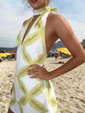 Daiiibabyyy  Women’s White Sleeveless Halter Mini Dress Featuring Yellow Abstract Leaf Motif, Deep V-Cut Neckline, Casual Summer Vacation