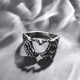 Daiiibabyyy  Vintage Punk Skull Hand with Heart-Shaped Ring for Men Women Hip Hop Gothic Skeleton Hand Ring Accessories Jewelry Gifts