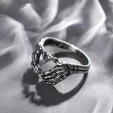 Daiiibabyyy  Vintage Punk Skull Hand with Heart-Shaped Ring for Men Women Hip Hop Gothic Skeleton Hand Ring Accessories Jewelry Gifts