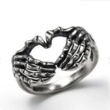 Daiiibabyyy  Vintage Punk Skull Hand with Heart-Shaped Ring for Men Women Hip Hop Gothic Skeleton Hand Ring Accessories Jewelry Gifts