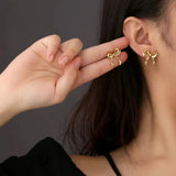 DAIIIBABYYY  -  Korean Fashion Ribbon Bow-knot Earrings for Women Cute Bow Metal Stud Earring Girls Charm Wedding Party Jewelry Gift