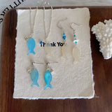 DAIIIBABYYY  -  Acrylic blue and white fish necklace