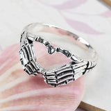 Daiiibabyyy  Vintage Punk Skull Hand with Heart-Shaped Ring for Men Women Hip Hop Gothic Skeleton Hand Ring Accessories Jewelry Gifts