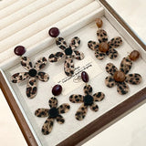 Leopard print holiday flower earrings