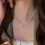 Daiiibabyyy  Retro double-layer pearl necklace light luxury literary niche design high-end sense pendant collarbone high-end neck chain