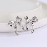 DAIIIBABYYY  -  Korean Fashion Ribbon Bow-knot Earrings for Women Cute Bow Metal Stud Earring Girls Charm Wedding Party Jewelry Gift