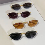 Daiiibabyyy  Retro Frameless Trimmed Cat Eye Rivet Small Frame Sunglasses for Men and Women Round Face Slimming Hip-hop Trampoline Sunglasses