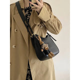 Daiiibabyyy Fashionable versatile student crossbody bag women new trendy retro armpit bag French niche single shoulder crescent bag