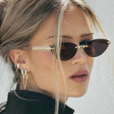 Daiiibabyyy  Retro Frameless Trimmed Cat Eye Rivet Small Frame Sunglasses for Men and Women Round Face Slimming Hip-hop Trampoline Sunglasses