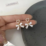 Daiiibabyyy  Korean Fashion Charm White Bowknot Stud Earring for Women Temperament Pearls Bow Heart Earrings Party Jewelry Accessories Gift