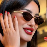 Daiiibabyyy  Retro Frameless Trimmed Cat Eye Rivet Small Frame Sunglasses for Men and Women Round Face Slimming Hip-hop Trampoline Sunglasses