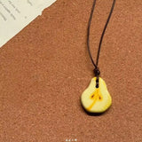 Daiiibabyyy  Ceramic fruit skin rope pendant with adjustable necklace