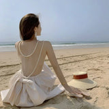 DAIIIBABYYY  -  Super Fairy Sexy Sanya Beach Resort Party Skirt Women Elegant Pearl Backless Bow Dress Summer Holiday Apricot Glossy Midi Dress
