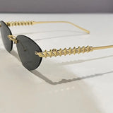 Daiiibabyyy  Retro Frameless Trimmed Cat Eye Rivet Small Frame Sunglasses for Men and Women Round Face Slimming Hip-hop Trampoline Sunglasses