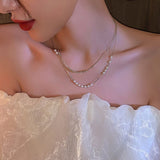 Imitation pearl necklace female 2022 new super fairy double layered clavicle chain light luxury daiiibabyyy