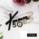Vintage hanger camellia tassel chain pin brooch woman party flower number 5 brooches sweater accessories daiiibabyyy