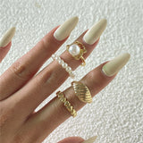 Daiiibabyyy 4pcs/set Vintage Pearl Spider Finger Rings Gold Punk Geometric Bread Heart Shape Rings For Women Party Jewelry Gift